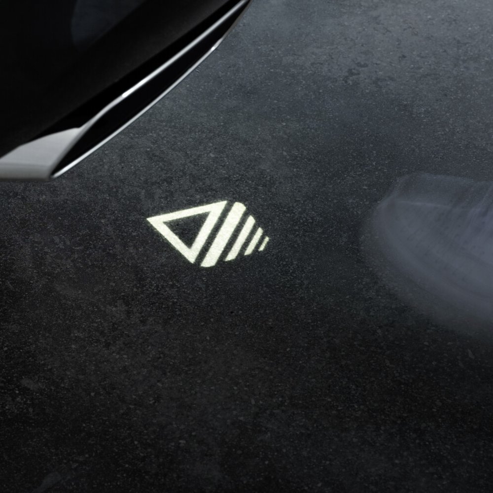 Tailgate kick marker projected behind the car